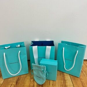 Tiffany & Co. shopping bags, jewelry box, and dust bag